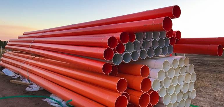 banner-plumbing-24-pipes-stacked-outside