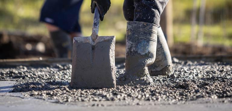 Pushing concrete with a shovel