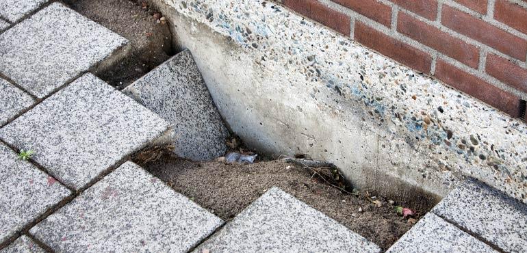 banner-complaints-33-slumped-ground-wall-pavers