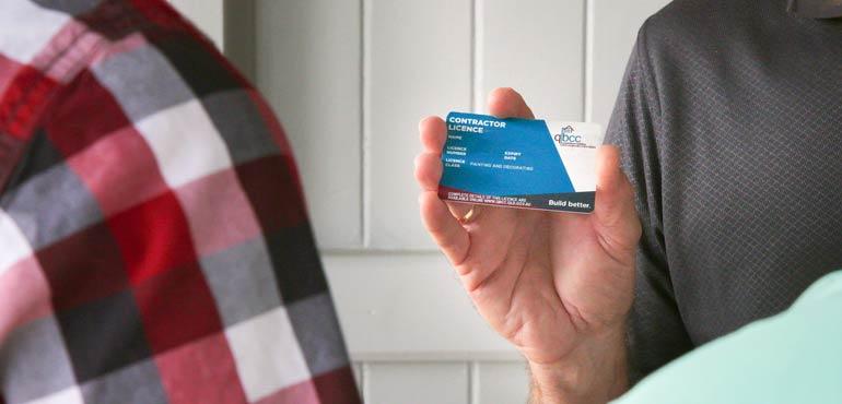banner-licence-1-showing-card-to-customer