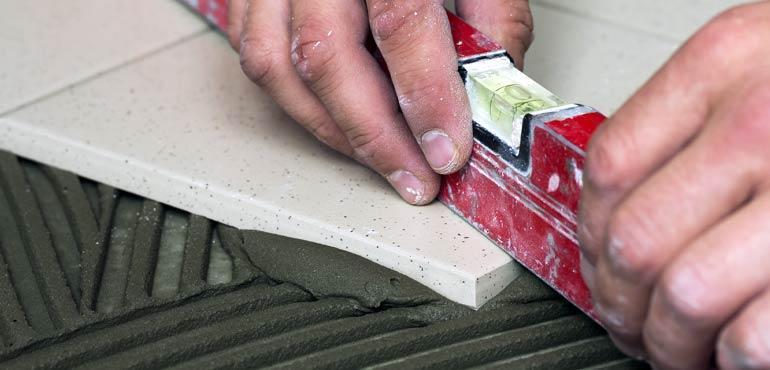 banner-licence-7-level-hands-tile-grout