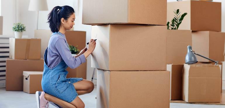 banner-property-14-woman-writing-boxes
