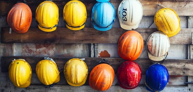 banner-complaints-42-hard-hats-on-wall