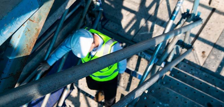 banner-compliance-13-officer-going-down-stairs