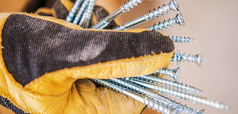 banner-property-9-gloved-hand-silver-screws