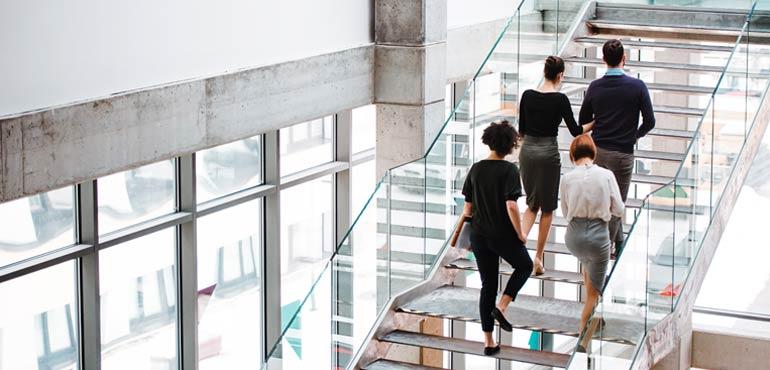 banner-about-22-staff-on-stairs
