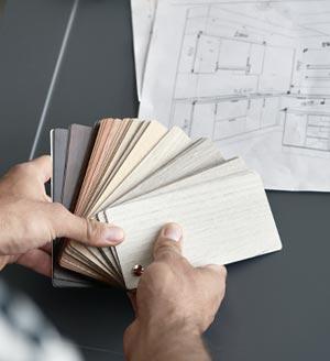 Displaying sample cards to pick finish of flooring.