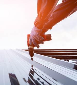 Roofers drilling roofing